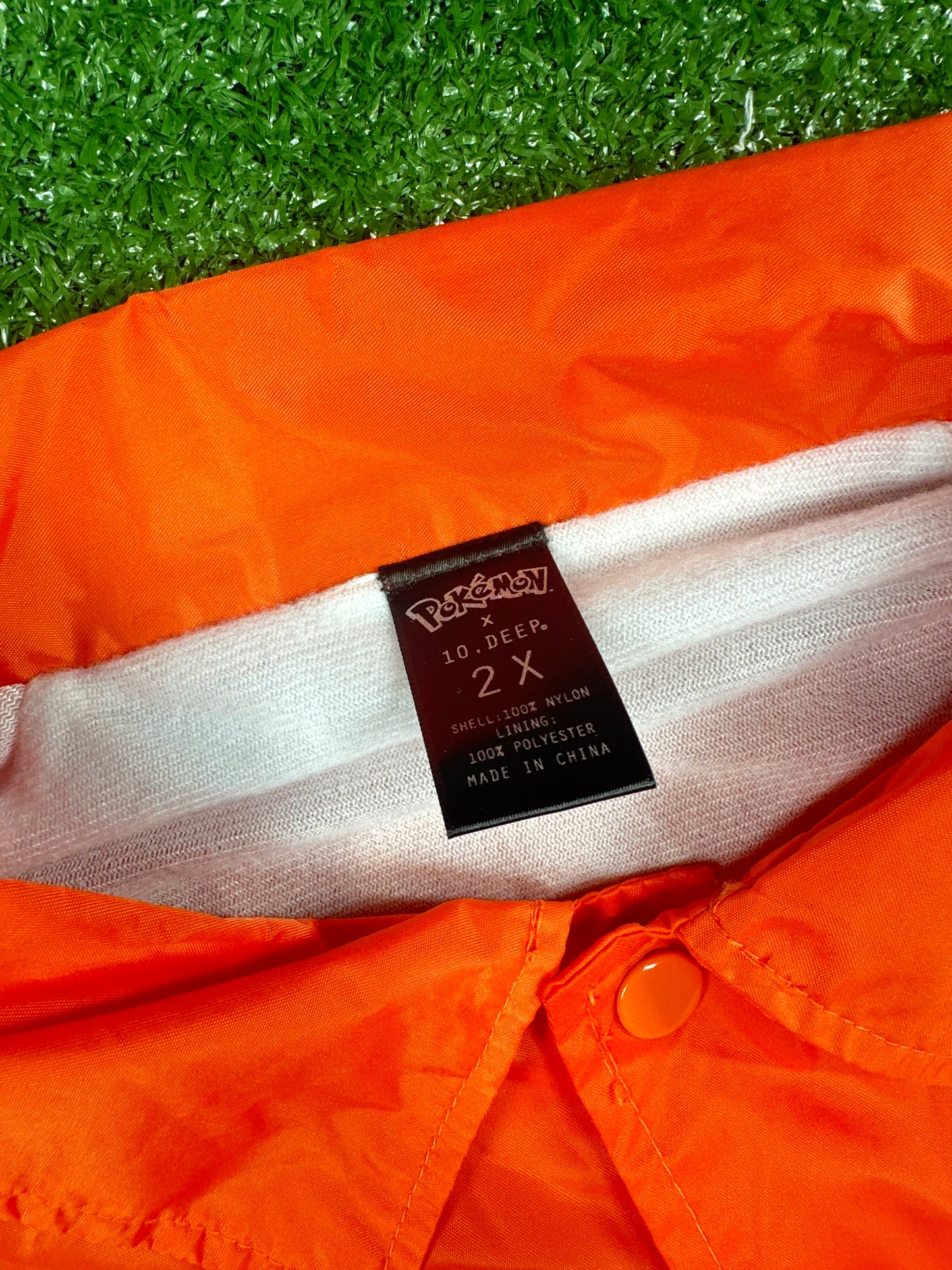 10 Deep X Pokemon 'Team Rocket' Orange Windbreaker - Size XXL